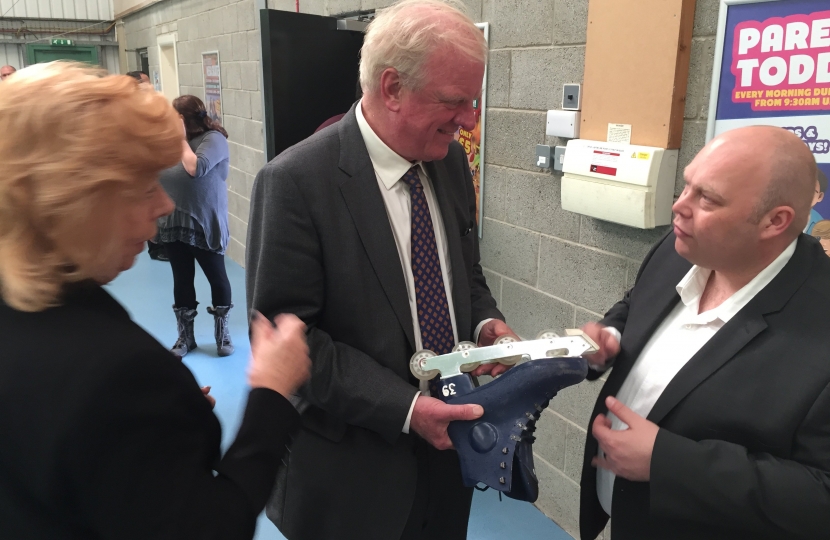 Cllr. Mrs. Jessie Milne and Sir Edward Leigh MP inspect one of the specially designed off-ice skates with Matt Lloyd