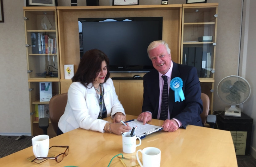 Sir Edward submits his nomination papers to Manjeet Gill, the returning officer