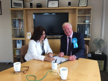 Sir Edward submits his nomination papers to Manjeet Gill, the returning officer