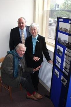 William Parry, Mick Tinker (sitting) and Gillian Bardsley warm their hands